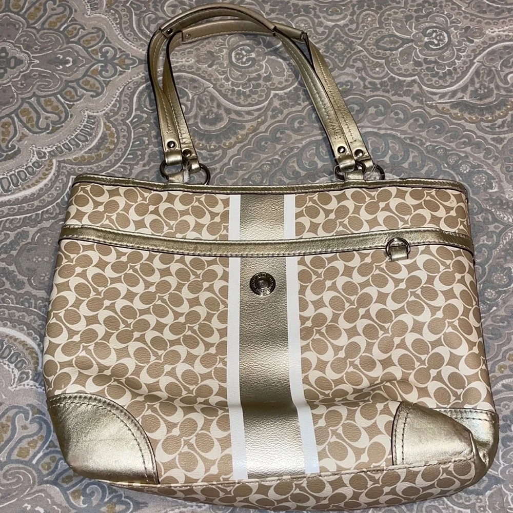 Gold coach purse with lavender inside